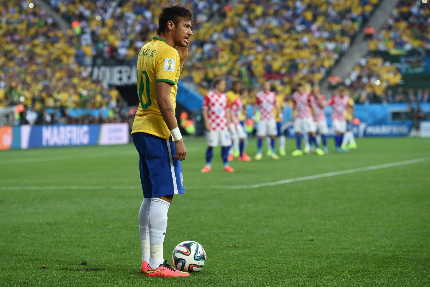 Neymar prepares to take a free kick during Brazil's opening match of the 2014 FIFA World Cup against Croatia. (Krassotkin/Wikimedia Commons)